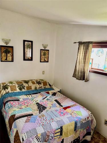 307 Elm Drive, Oak Lake Beach, MB - Indoor Photo Showing Bedroom