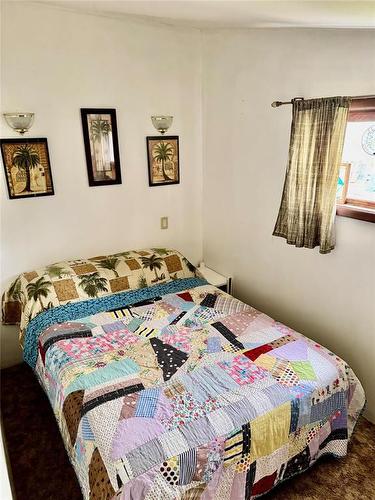 307 Elm Drive, Oak Lake Beach, MB - Indoor Photo Showing Bedroom