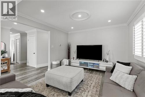 Living area featuring recessed lighting, a decorative ceiling medallion, crown molding, and wood-finish flooring - 27 Barbara Court, Hamilton, ON - Indoor Photo Showing Living Room