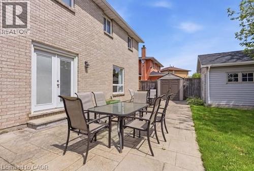 Expansive stone patio with direct access via French doors - 27 Barbara Court, Hamilton, ON - Outdoor With Deck Patio Veranda With Exterior