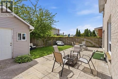 Expansive outdoor patio with stamped concrete pavers - 27 Barbara Court, Hamilton, ON - Outdoor With Deck Patio Veranda
