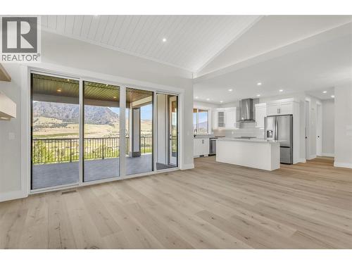 Living Room looking into Kitchen - 2150 Montenegro Drive, Kelowna, BC - Indoor