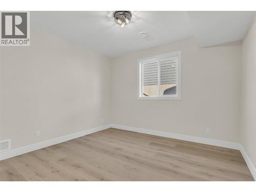 Lower Level Bedroom #1 - 2150 Montenegro Drive, Kelowna, BC - Indoor Photo Showing Other Room