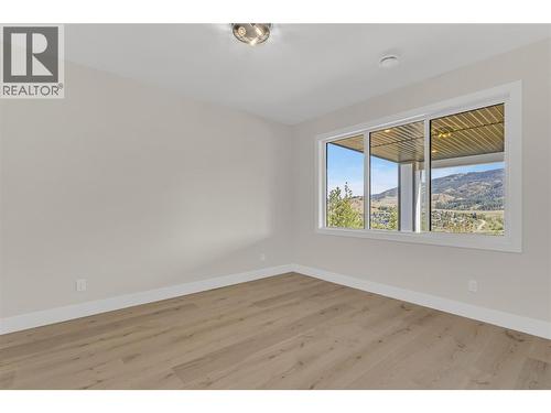 Lower Level Bedroom #2 - 2150 Montenegro Drive, Kelowna, BC - Indoor Photo Showing Other Room