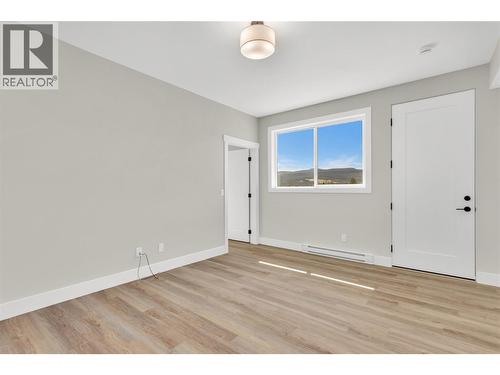Legal Suite Entry and Living Room - 2150 Montenegro Drive, Kelowna, BC - Indoor Photo Showing Other Room