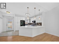Updated kitchen with new cabinets, counter tops & backsplash - 