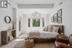 Primary bedroom with elevated ceilings **virtually staged** - 