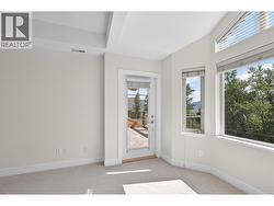 Lake can be seen from your bed looking through this glass door - 