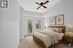 Secondary bedroom/office with it's own patio **virtually staged** - 