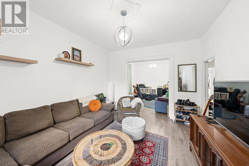 Modern fixture above, leading into dining room. - 277 Arlington Avenue, Ottawa, ON - Indoor Photo Showing Living Room