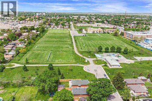 Expansive parkland featuring multiple sports fields, open green spaces, and a dedicated playground area - 435 East 36Th Street, Hamilton, ON - Outdoor With View