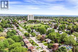 Aerial perspective showcasing residential streets lined with established homes and mature trees - 