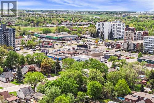 Aerial perspective showcasing a residential and commercial area with multiple multi-story buildings and single-family homes - 435 East 36Th Street, Hamilton, ON - Outdoor With View