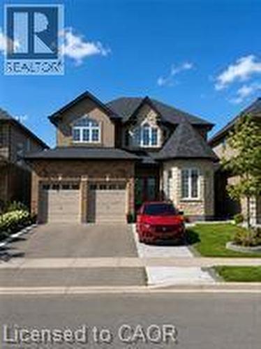 Stone and stucco facade featuring a two-car garage - 85 Showcase Drive Unit# Main, Hamilton, ON - Outdoor With Exterior