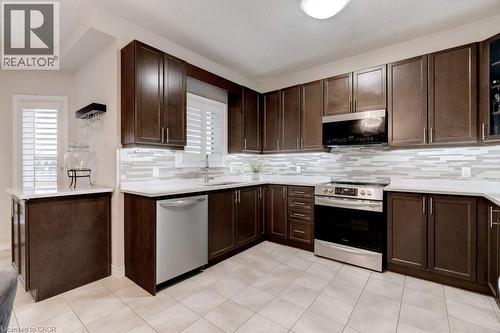 85 Showcase Drive Unit# Main, Hamilton, ON - Indoor Photo Showing Dining Room With Fireplace