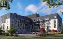 Contemporary multi-story building featuring a contrasting dark and light facade - 1936 Rymal Road E Unit# 512, Hamilton, ON  - Outdoor With Facade 