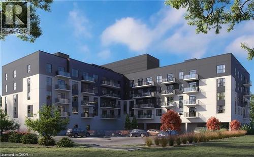 Contemporary multi-story building featuring a contrasting dark and light facade - 1936 Rymal Road E Unit# 512, Hamilton, ON - Outdoor With Facade