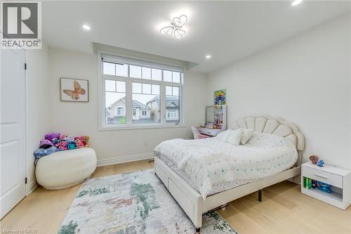 Spacious room with light wood-finish flooring and recessed lighting - 3937 Leonardo Street, Burlington, ON - Indoor Photo Showing Bedroom