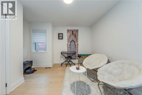 Bright interior space featuring light wood-finish flooring and crisp white walls - 3937 Leonardo Street, Burlington, ON - Indoor