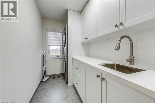 White shaker cabinetry with brushed nickel hardware, integrated sink, and gooseneck faucet - 3937 Leonardo Street, Burlington, ON - Indoor Photo Showing Kitchen