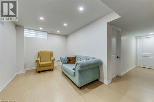 Spacious room featuring light wood-finish flooring, recessed ceiling lighting, and white baseboards - 3937 Leonardo Street, Burlington, ON - Indoor Photo Showing Basement