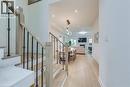 Hardwood flooring extends throughout this luminous entryway and main living area - 3937 Leonardo Street, Burlington, ON  - Indoor Photo Showing Other Room 