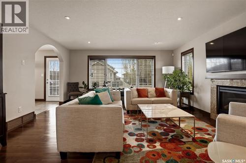 8034 Fairways West Drive, Regina, SK - Indoor Photo Showing Living Room With Fireplace