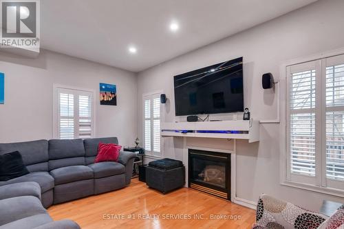 7448 Village Walk, Mississauga, ON - Indoor Photo Showing Living Room With Fireplace