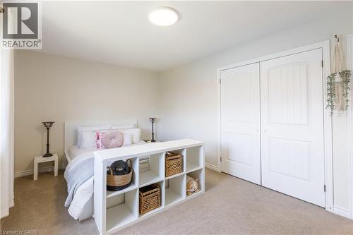 Neutral tone walls complement the light-colored carpeting - 10 Redbud Crescent, Simcoe, ON - Indoor Photo Showing Bedroom