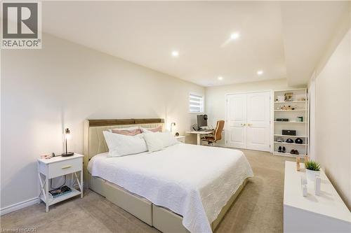 Light-colored wall-to-wall carpeting complements the neutral wall tones - 10 Redbud Crescent, Simcoe, ON - Indoor Photo Showing Bedroom