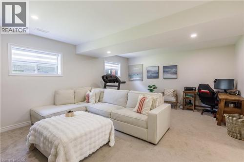 Carpeted recreation room with recessed lighting - 10 Redbud Crescent, Simcoe, ON - Indoor