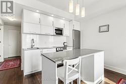 Kitchen with island and stainless steel appliances - 