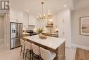 Virtually staged for illustrative purposes - 101 Bedell Drive, Mapleton, ON  - Indoor Photo Showing Kitchen With Upgraded Kitchen 