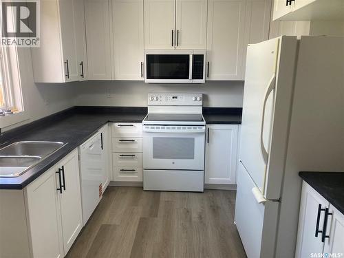 349 X Avenue S, Saskatoon, SK - Indoor Photo Showing Kitchen With Double Sink