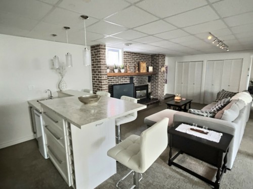 Salle familiale - 166 18E Rue, Rouyn-Noranda, QC - Indoor With Fireplace