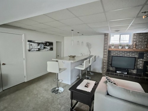 Salle familiale - 166 18E Rue, Rouyn-Noranda, QC - Indoor With Fireplace