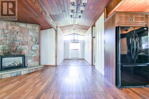 22 Talon Trail, Tiny, ON - Indoor Photo Showing Other Room With Fireplace