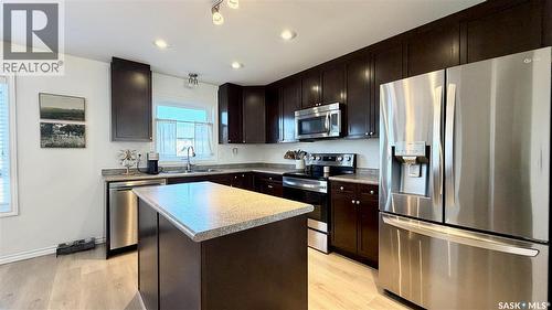 230 Veltkamp Lane, Saskatoon, SK - Indoor Photo Showing Kitchen With Double Sink