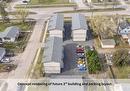 Concept rendering of future 3rd building and existing asphalt parking layout. - 210 Main Street, Selkirk, MB  -  With View 