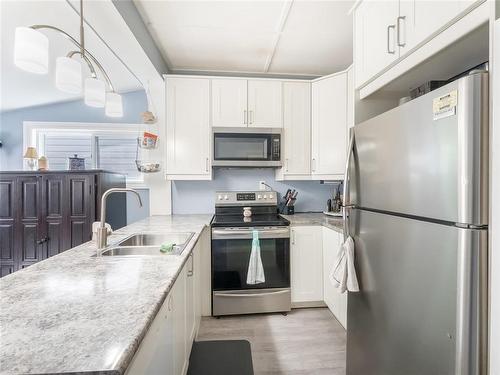 76 Noble Avenue, Winnipeg, MB - Indoor Photo Showing Kitchen With Double Sink