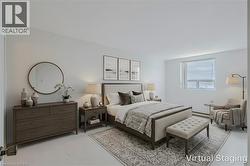 Bedroom featuring light gray walls and a single window with blinds - 