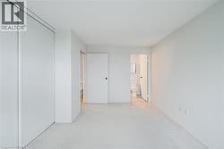 Light-colored carpeting complementing neutral wall tones - 