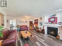 190 Redden Road, Quesnel, BC  - Indoor Photo Showing Living Room With Fireplace 