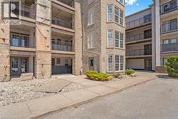 Stone exterior with multiple balconies and large windows - 