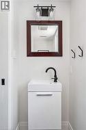 Modern floating vanity with an integrated rectangular sink and matte black faucet - 