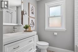 Modern white vanity with integrated sink and chrome faucet - 