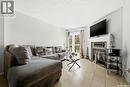6427 Rochdale Boulevard, Regina, SK  - Indoor Photo Showing Living Room With Fireplace 