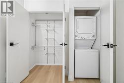 Interior closet featuring wood-finish flooring and an adjustable wire shelving system - 