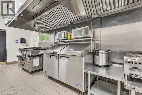 Commercial kitchen featuring stainless steel appliances and fixtures - 5 Manitou Drive Unit# 106B, Kitchener, ON 