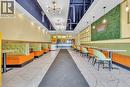 Commercial interior featuring white tile flooring, recessed lighting, and exposed ceiling ductwork - 5 Manitou Drive Unit# 106B, Kitchener, ON 